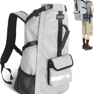 Gray dog carrier backpack with padded straps, side mesh pocket, and front flap storage pocket
