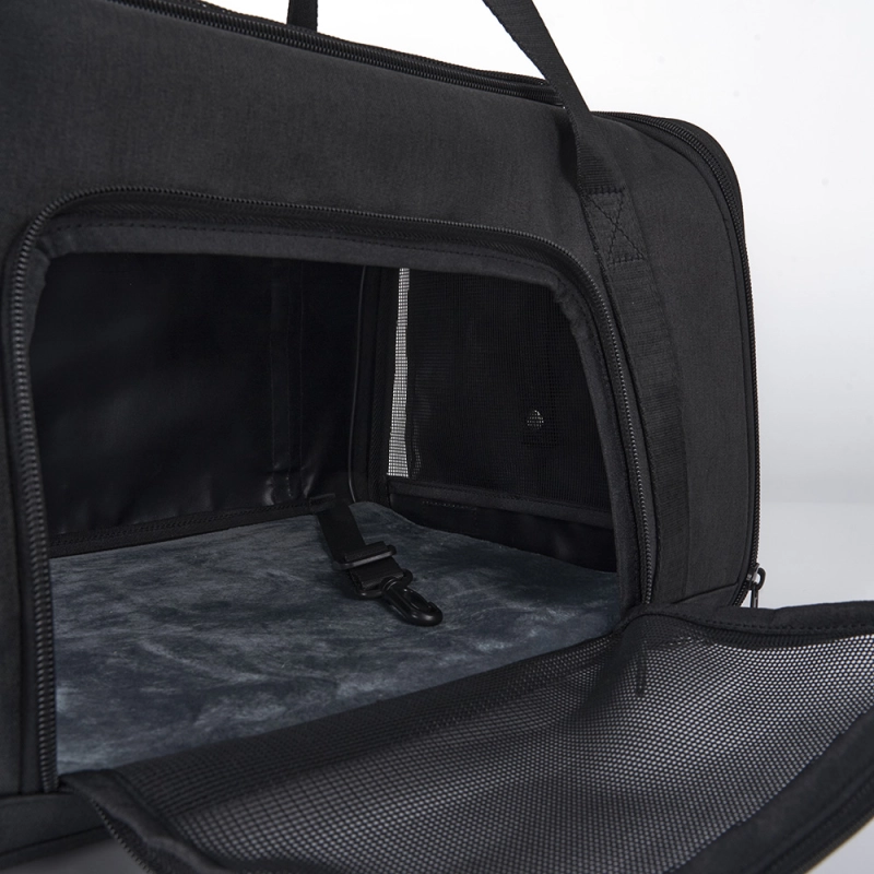 Close-up of the Stridepaw pet carrier interior featuring a plush removable mat, secure tether clip, and ventilated mesh door for comfortable pet travel